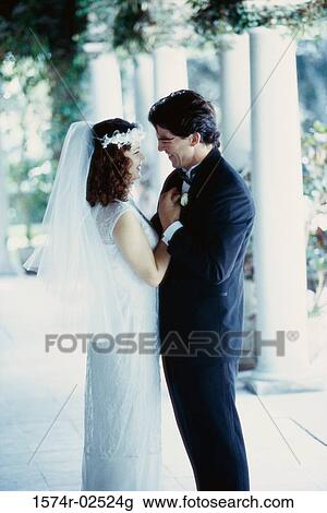 Side profile of a newlywed couple smiling View Large Photo Image Stock Image - Side profile of a newlywed couple smiling. Fotosearch
