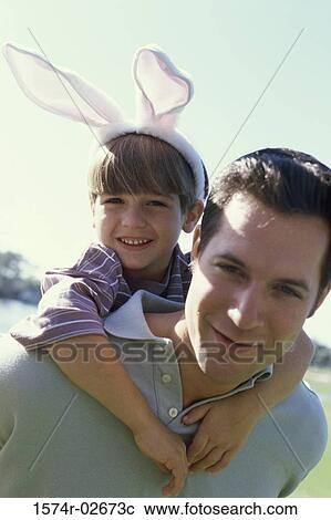 Son riding piggyback on his father View Large Photo Image Stock Image - Son riding piggyback on his father. Fotosearch
