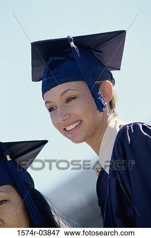Stock Photo - Young female graduate smiling. Fotosearch