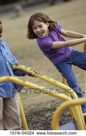 Girls on a merry-go-round View Large Photo Image Picture - Girls on a merry-go-round. Fotosearch