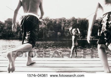 Group of children playing in water View Large Photo Image Stock Image - Group of children playing in water. Fotosearch