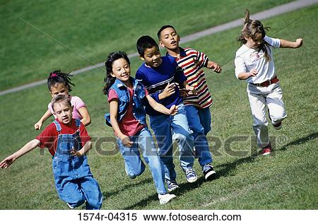Stock Photography - Group of children running on a lawn. Fotosearch