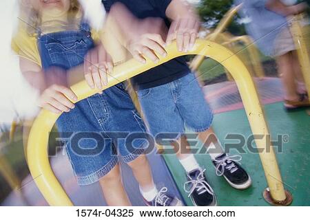 Low section view of children on a merry-go-round View Large Photo Image Stock Photography - Low section view of children on a merry-go-round. Fotosearch
