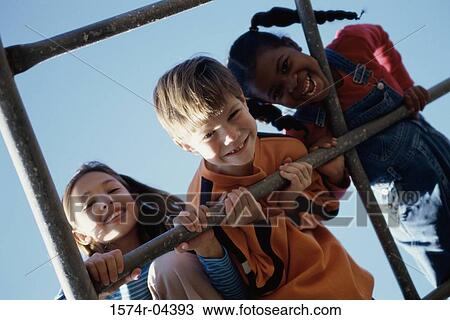 Portrait of a boy and two girls on monkey bars View Large Photo Image Stock Image - Portrait of a boy and two girls on monkey bars. Fotosearch
