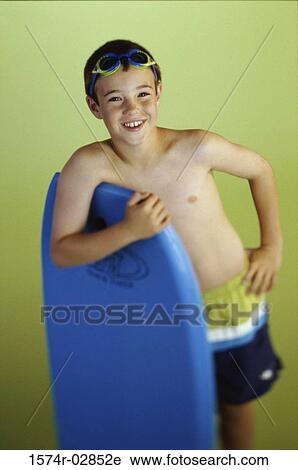 Portrait of a boy holding a boogie board View Large Photo Image Stock Image - Portrait of a boy holding a boogie board. Fotosearch