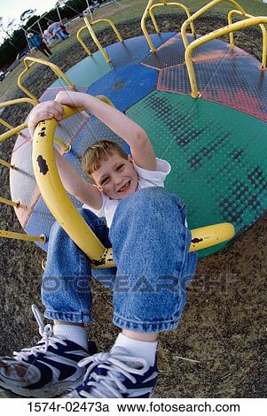 Portrait of a boy on a merry-go-round View Large Photo Image Stock Image - Portrait of a boy on a merry-go-round. Fotosearch