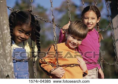 Portrait of girls and a boy on a jungle gym View Large Photo Image Stock Photography - Portrait of girls and a boy on a jungle gym. Fotosearch