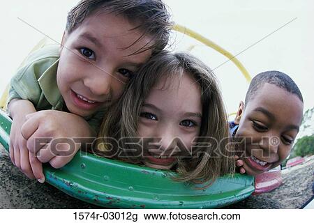 Portrait of two boys and a girl playing View Large Photo Image Stock Image - Portrait of two boys and a girl playing. Fotosearch