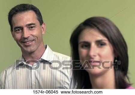 Portrait of a businessman and a businesswoman smiling View Large Photo Image Stock Photography - Portrait of a businessman and a businesswoman smiling. Fotosearch