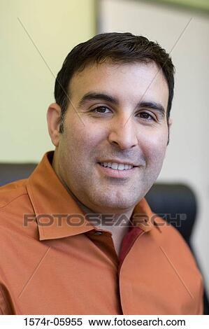 Portrait of a businessman sitting in an office View Large Photo Image Stock Photography - Portrait of a businessman sitting in an office. Fotosearch