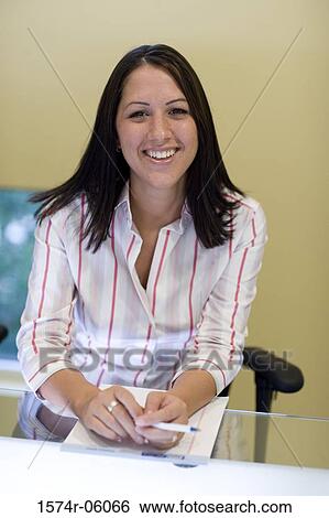 Portrait of a businesswoman sitting in an office View Large Photo Image Stock Photograph - Portrait of a businesswoman sitting in an office. Fotosearch