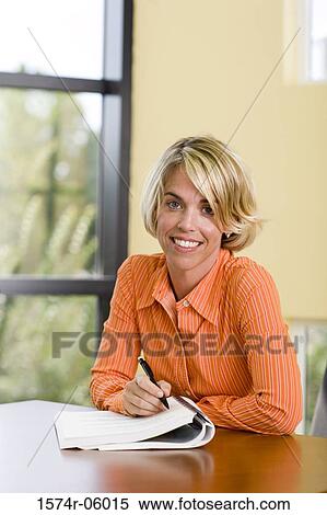 Portrait of a businesswoman sitting in an office View Large Photo Image Stock Photography - Portrait of a businesswoman sitting in an office. Fotosearch