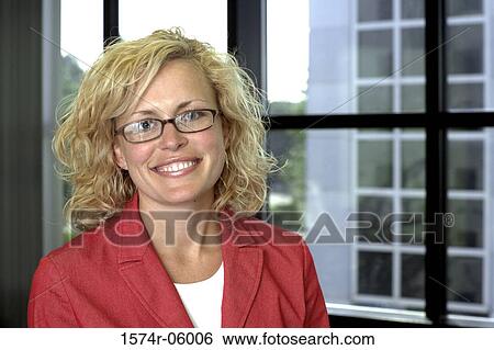 Portrait of a businesswoman smiling in an office View Large Photo Image Stock Photograph - Portrait of a businesswoman smiling in an office. Fotosearch