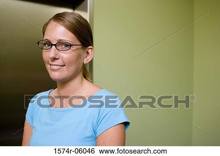 Portrait of a businesswoman smiling in an office View Large Photo Image Stock Photograph - Portrait of a businesswoman smiling in an office. Fotosearch