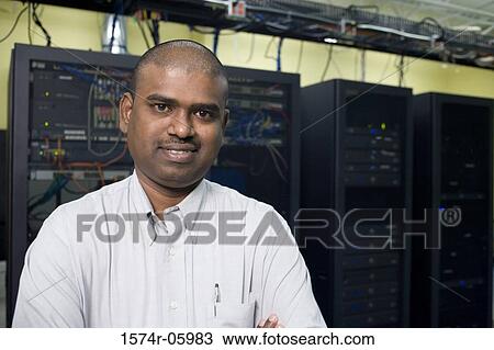 Portrait of a technician standing in a server room View Large Photo Image Stock Image - Portrait of a technician standing in a server room. Fotosearch