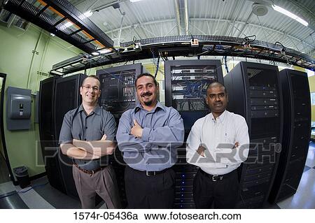 Portrait of three technicians standing in a server room View Large Photo Image Stock Image - Portrait of three technicians standing in a server room. Fotosearch