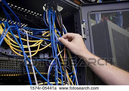 Close-up of a human hand attaching cables to a network server View Large Photo Image Stock Image - Close-up of a human hand attaching cables to a network server. Fotosearch