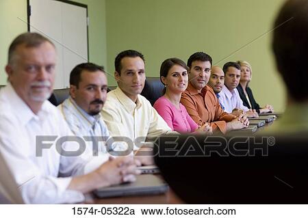 Portrait of a group of business executives sitting around a conference table View Large Photo Image Stock Image - Portrait of a group of business executives sitting around a conference table. Fotosearch