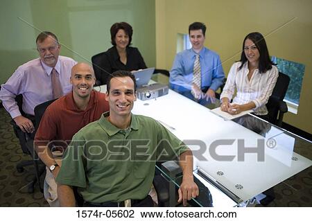 Portrait of a group of business executives sitting around a conference table View Large Photo Image Stock Image - Portrait of a group of business executives sitting around a conference table. Fotosearch