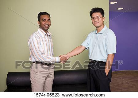 Two businessmen shaking hands View Large Photo Image Stock Image - Two businessmen shaking hands. Fotosearch