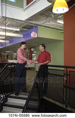 Stock Photography - Two businessmen shaking hands. Fotosearch