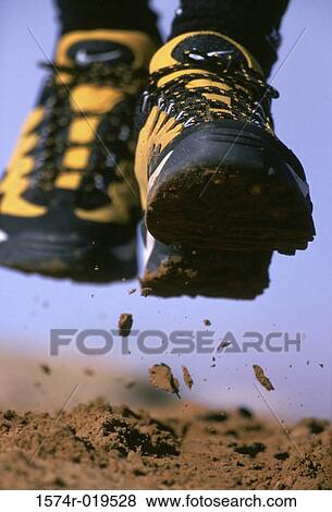 Close-up of feet of person running View Large Photo Image Stock Photo - Close-up of feet of person running. Fotosearch