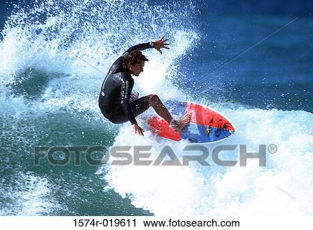 High angle view of a man surfing in the sea View Large Photo Image Stock Image - High angle view of a man surfing in the sea. Fotosearch