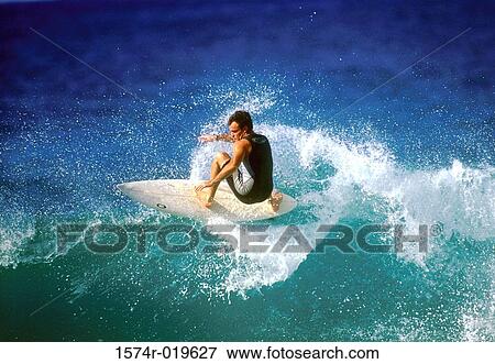 High angle view of a man surfing in the sea View Large Photo Image Stock Photo - High angle view of a man surfing in the sea. Fotosearch