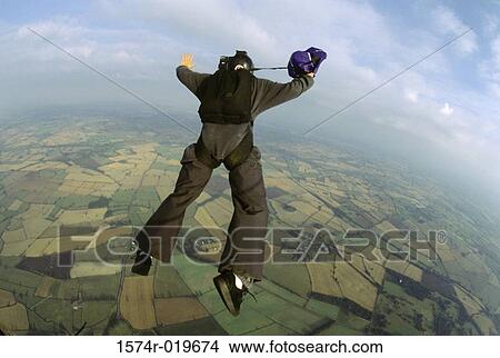 High angle view of a person base jumping View Large Photo Image Picture - High angle view of a person base jumping. Fotosearch