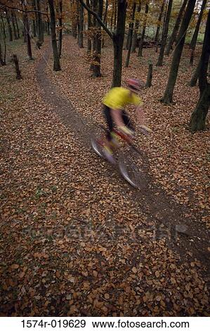 High angle view of a person mountain biking View Large Photo Image Stock Photo - High angle view of a person mountain biking. Fotosearch