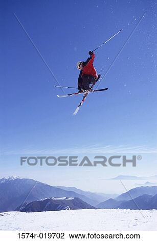 Low angle view of a man skiing View Large Photo Image Stock Image - Low angle view of a man skiing. Fotosearch