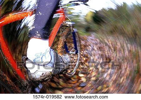 Low section view of a person mountain biking View Large Photo Image Stock Image - Low section view of a person mountain biking. Fotosearch