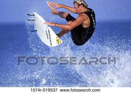 Mature adult man surfing View Large Photo Image Stock Photo - Mature adult man surfing. Fotosearch