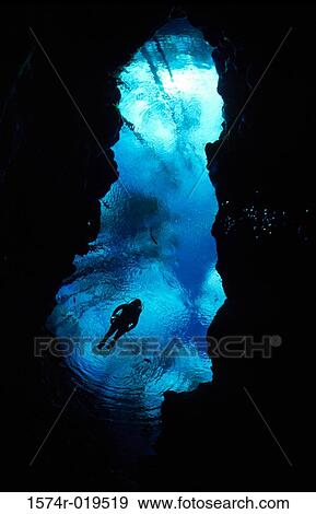 Scuba diving near underwater cave View Large Photo Image Stock Photo - Scuba diving near underwater cave. Fotosearch
