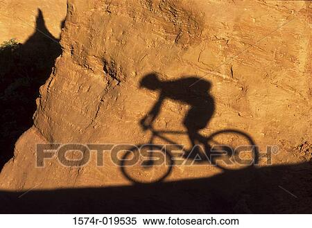 Shadow of person mountain biking View Large Photo Image Stock Photography - Shadow of person mountain biking. Fotosearch