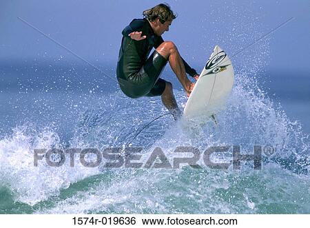 Side profile of a mid adult man surfing in the sea View Large Photo Image Stock Photograph - Side profile of a mid adult man surfing in the sea. Fotosearch