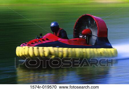 Side profile of a person riding a hovercraft View Large Photo Image Stock Image - Side profile of a person riding a hovercraft. Fotosearch