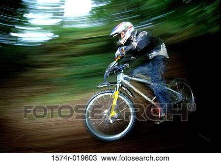 Side profile of a teenage boy riding a bicycle View Large Photo Image Stock Image - Side profile of a teenage boy riding a bicycle. Fotosearch