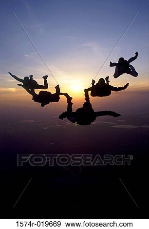 Silhouette of five people skydiving View Large Photo Image Stock Photo - Silhouette of five people skydiving. Fotosearch