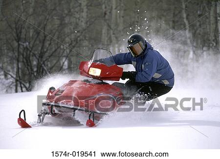 Snowmobiler leaning into turn, Colorado, USA View Large Photo Image Stock Image - Snowmobiler leaning into turn, Colorado, USA. Fotosearch
