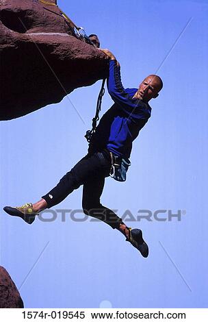 Young adult man mountain climbing, Utah, USA View Large Photo Image Stock Photography - Young adult man mountain climbing, Utah, USA. Fotosearch