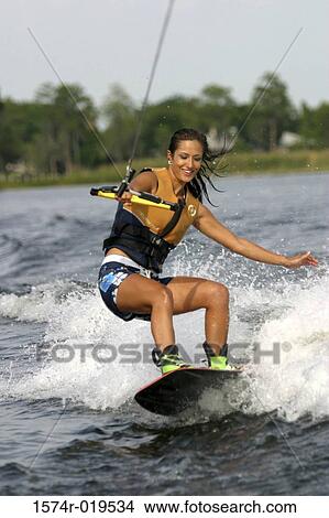 Young adult woman wakeboarding, Florida, USA View Large Photo Image Picture - Young adult woman wakeboarding, Florida, USA. Fotosearch