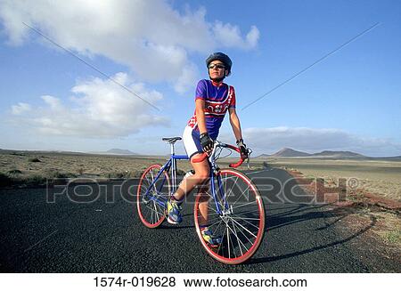 Young man on bicycle View Large Photo Image Stock Photo - Young man on bicycle. Fotosearch