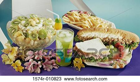Stock Image - Assortment of food served on a table. Fotosearch