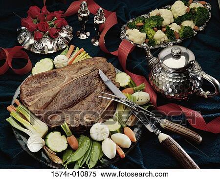 Stock Photography - Beef steak served with salad. Fotosearch