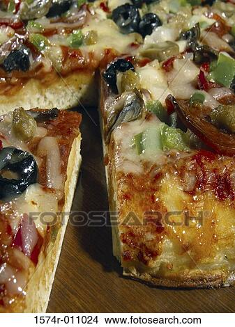 Picture - Close-up of a sliced pizza. Fotosearch