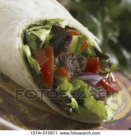 Stock Image - Close-up of a wrapped sandwich. Fotosearch