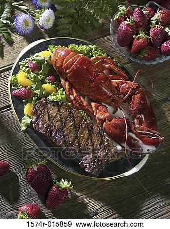 Close-up of seafood and steak on a plate View Large Photo Image Stock Photo - Close-up of seafood and steak on a plate. Fotosearch