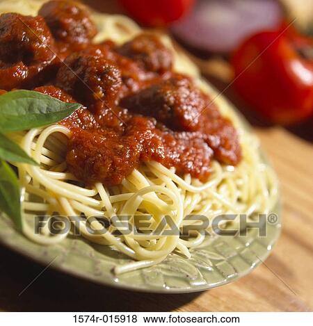 Close-up of spaghetti on a plate View Large Photo Image Stock Photo - Close-up of spaghetti on a plate. Fotosearch