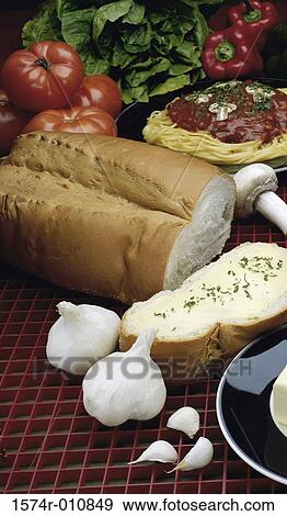 Stock Photo - Close-up of vegetables and baked bread. Fotosearch